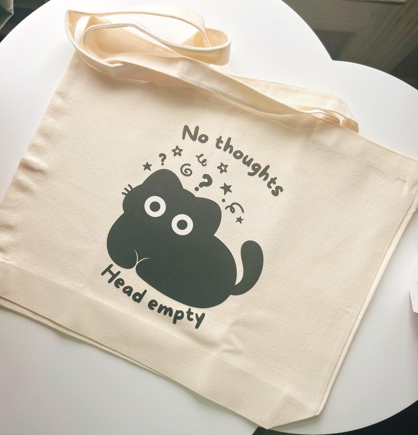 "No thoughts, Head empty" daily tote bag